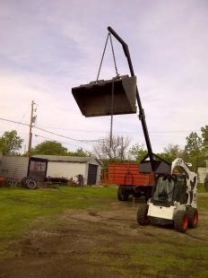 how to lift a skid steer with a crane|homemade skid steer attachments.